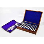 A mahogany cased twelve setting fish knives and forks with mother of pearl handles, and a cased