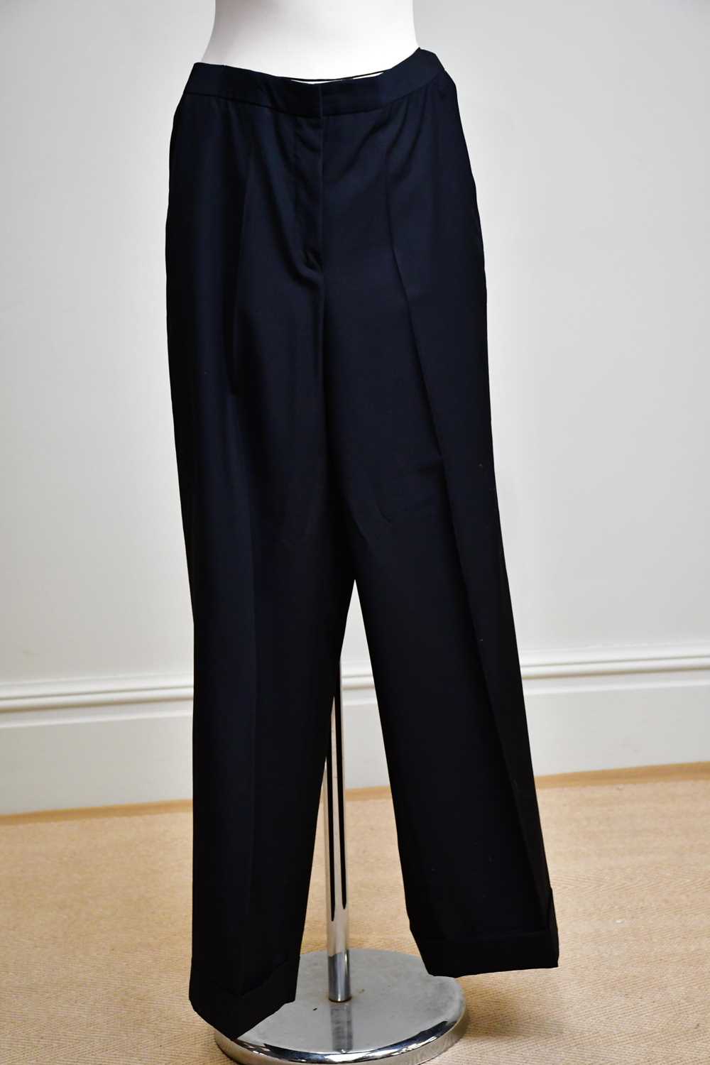 ALEXANDER MCQUEEN; a pair of 100% wool black wide leg lady's trousers, with turn up bottom, side