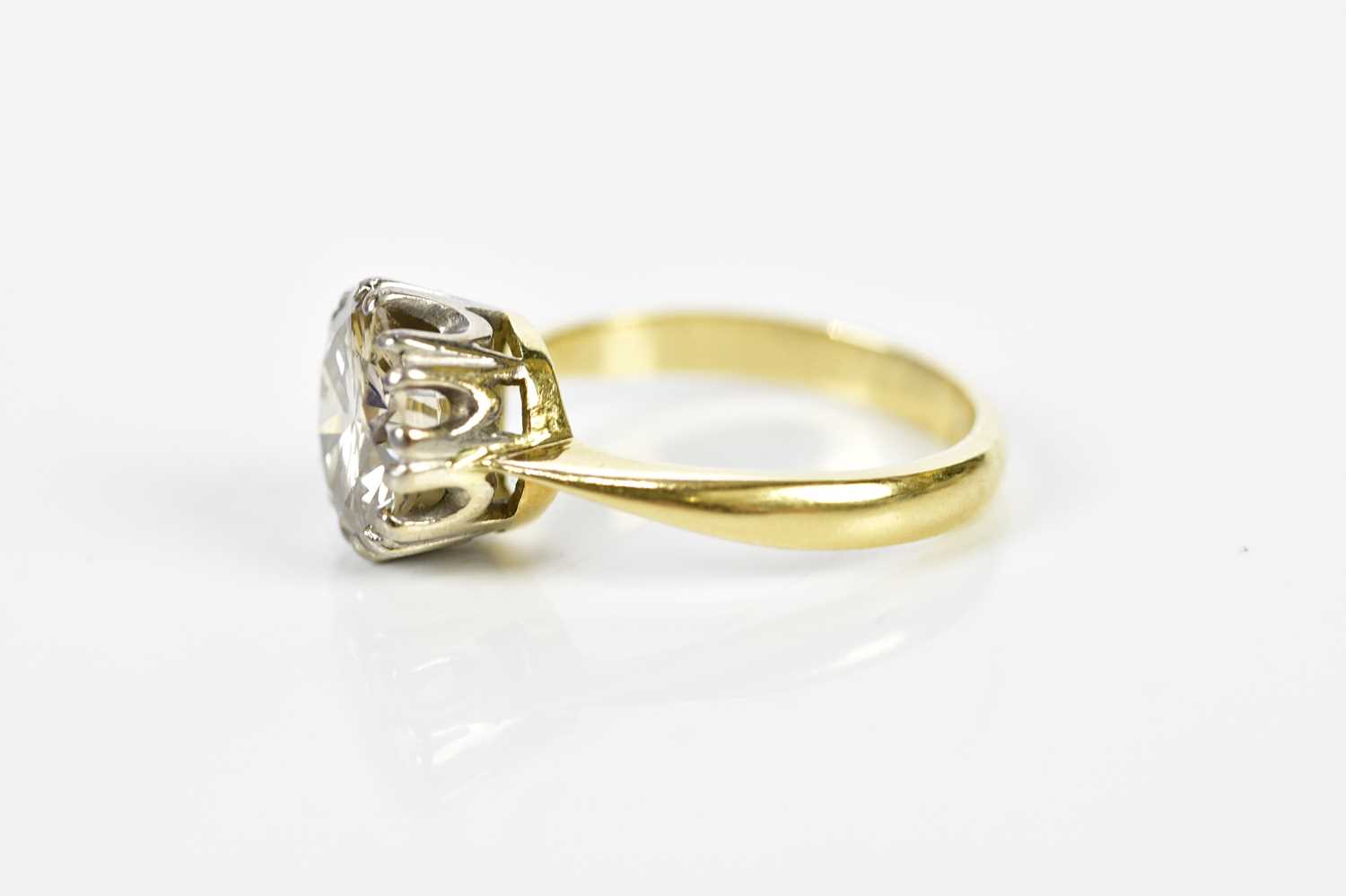 A yellow metal diamond solitaire ring, the round brilliant cut claw set stone weighing approx. 2. - Image 2 of 3