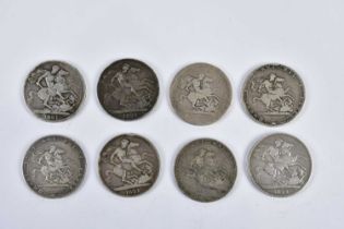 A collection of eight early 19th century Georgian silver crowns, comprising 1819 (x2), 1820, 1821 (