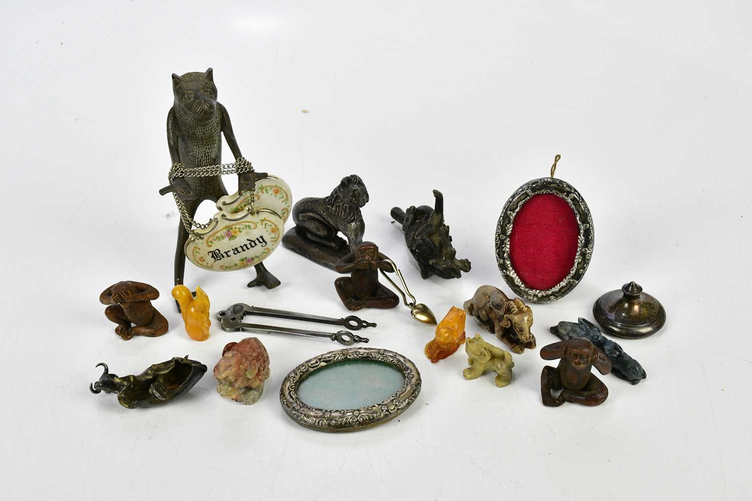 An assortment of collectors' items, including a Georgian hallmarked silver cow finial from a