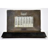 W J MYATT & Co; a George VI hallmarked silver mounted desk calendar with engine turned decoration,
