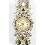 JAEGER-LECOULTRE; a lady's vintage 18ct white gold diamond set cocktail watch with signed circular