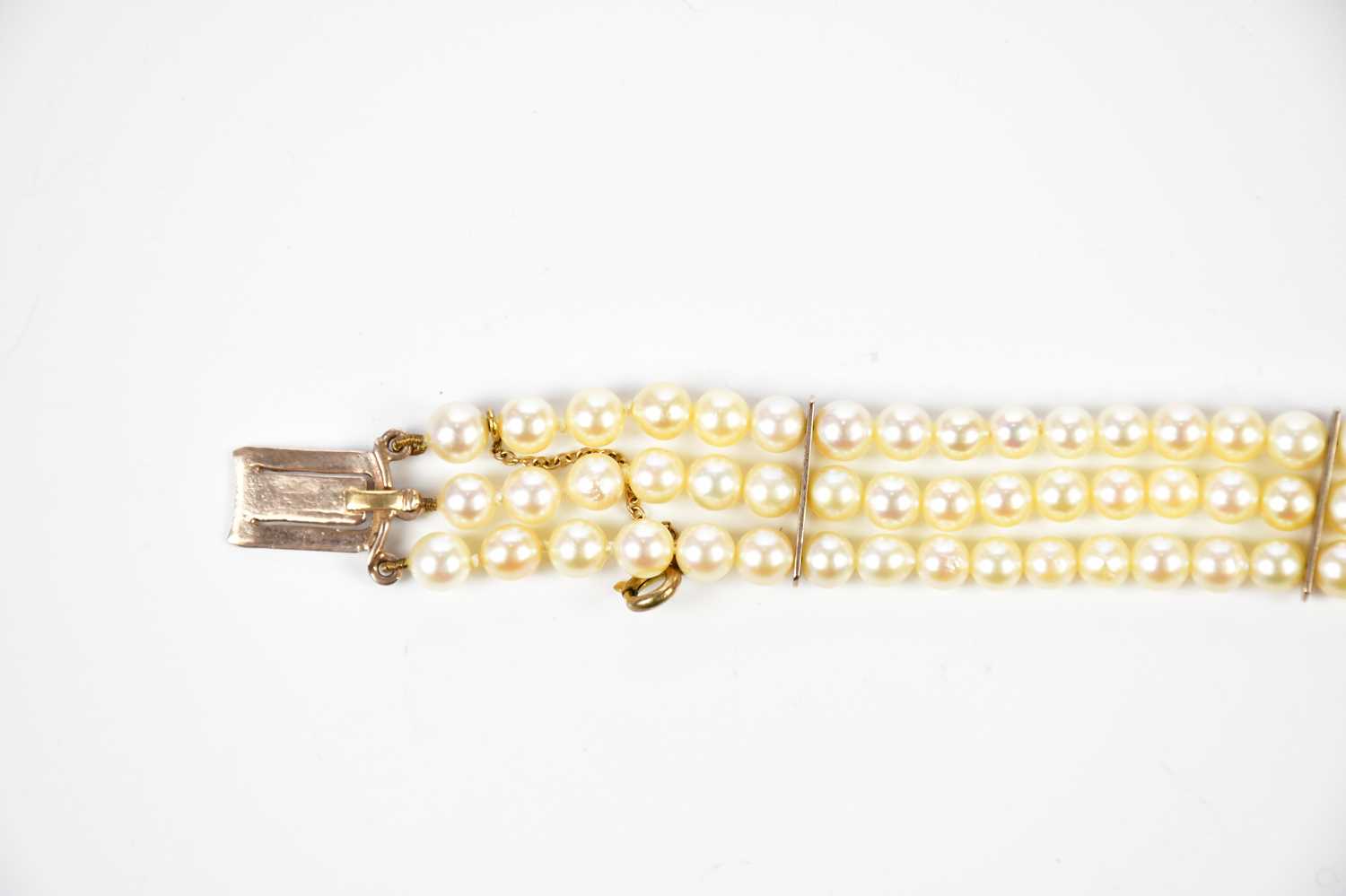 A three strand cultured pearl bracelet with large amethyst and pearl set 9ct gold clasp, length - Image 3 of 3