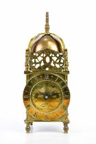 BUTT & CO; a brass mantel timepiece modelled as a lantern clock, height 28.5cm.