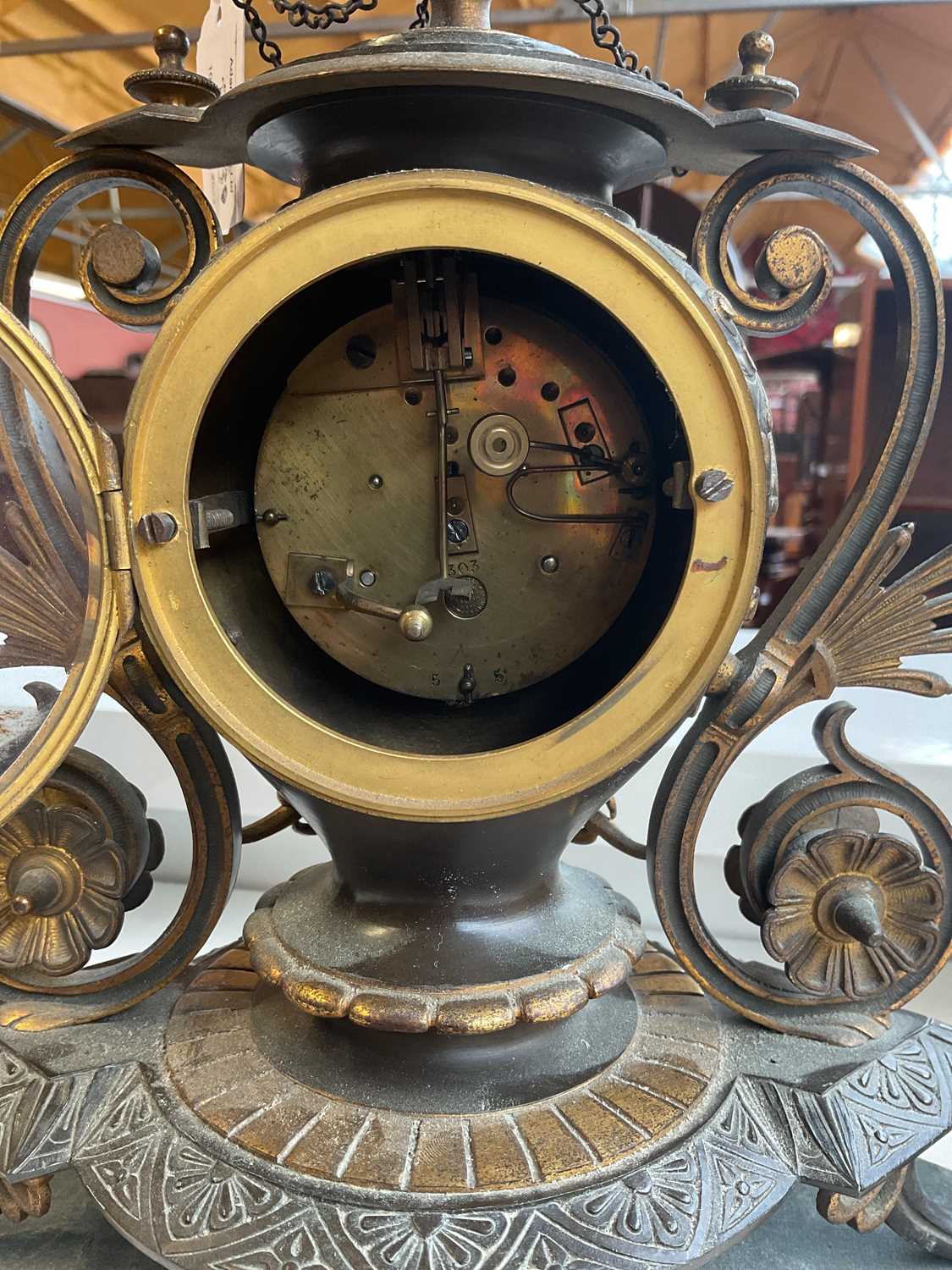 An aesthetic movement French bronze and gilt metal mantel clock with circular finial above the - Image 6 of 10