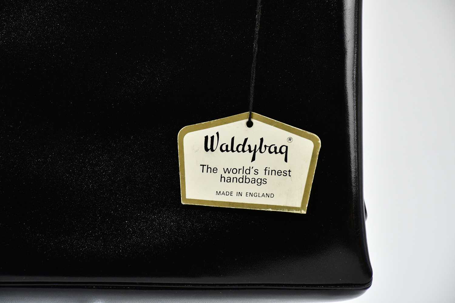 WALDYBAG; a 1950s unused and boxed black leather handbag with gold tone hardware, beige suede - Image 2 of 2