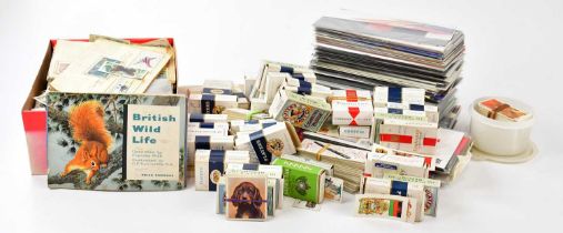 An extensive collection of cigarette and tea cards, and a collection of Royal Mail first day