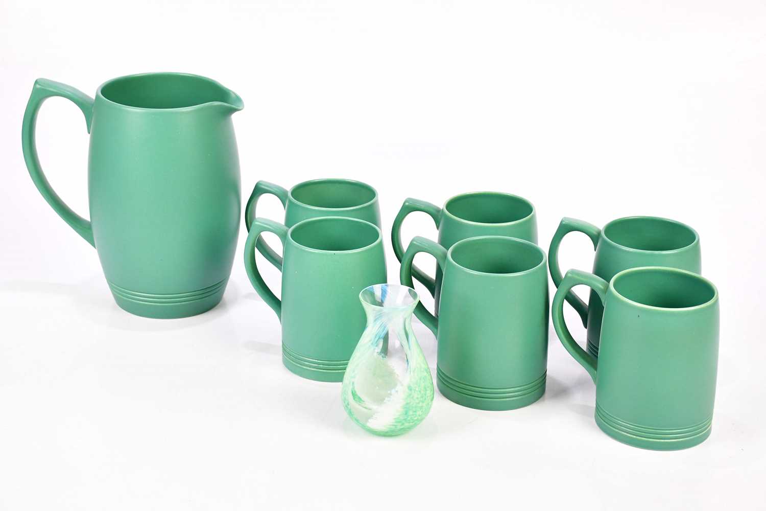 KEITH MURRAY FOR WEDGWOOD; a seven piece drinking set, comprising jug and six cups, also a Caithness