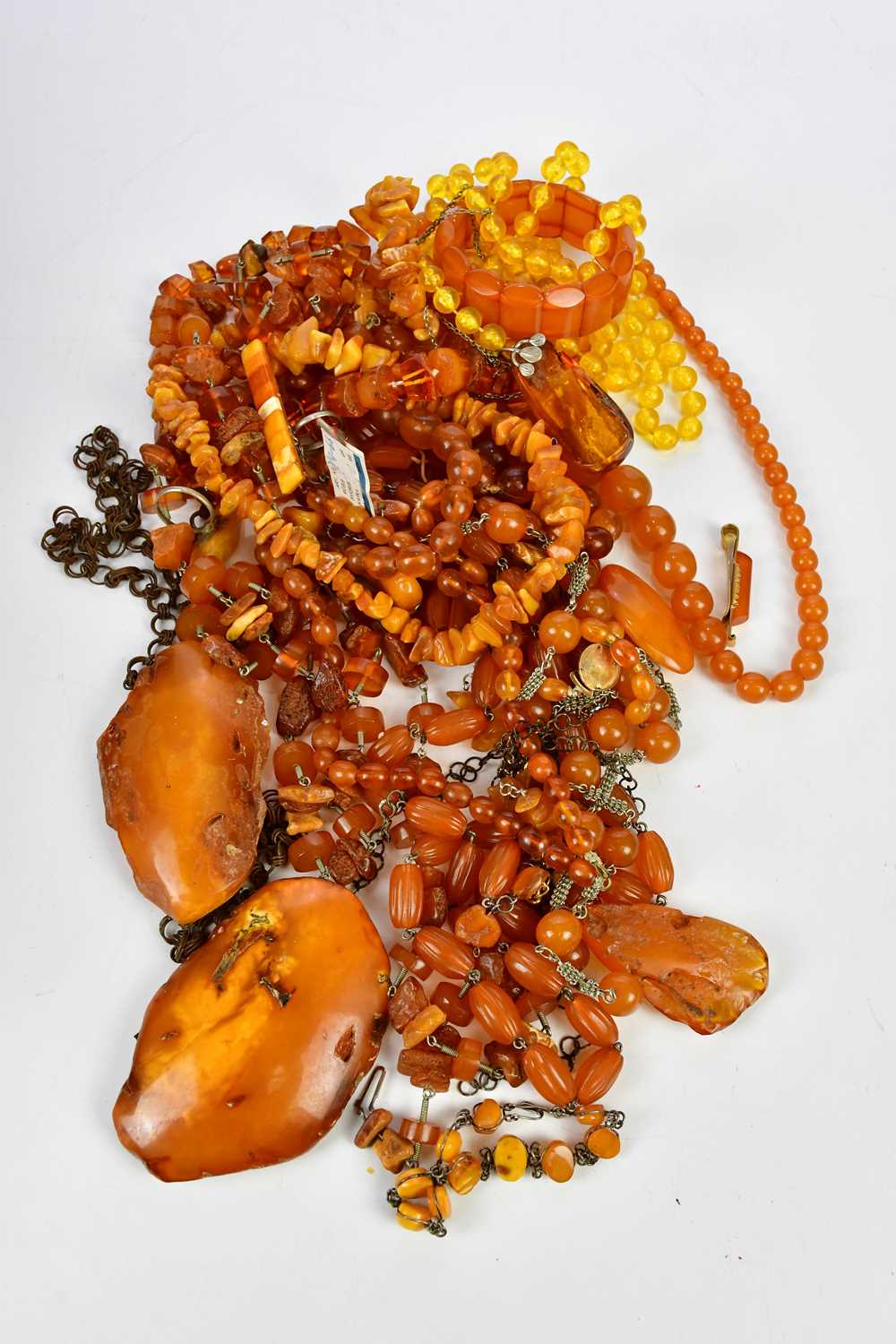 A large collection of Baltic amber, including graduated bead necklaces, some rough plaques, other