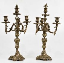 A pair of late 19th/early 20th century French silver plated four branch candelabra with cast