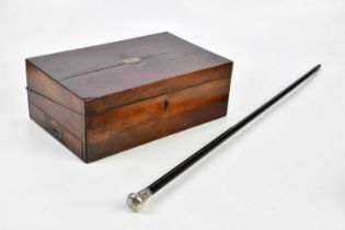 A 19th century mahogany writing slope, together with an ebonised cane with hallmarked silver top.