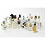 An extensive collection of empty designer perfume bottles including Hermés, Cartier, Gucci, Tom