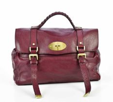 MULBERRY; a dark red leather Alexa satchel with gold brass tone hardware, front postman's lock and