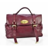 MULBERRY; a dark red leather Alexa satchel with gold brass tone hardware, front postman's lock and