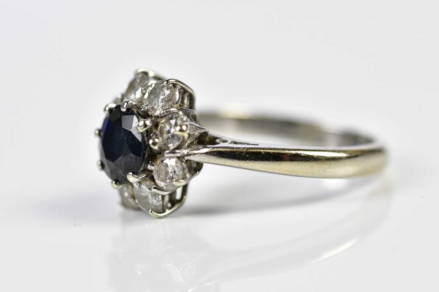 An 18ct white gold sapphire and diamond flowerhead ring, size J, approx. 4.2g. Condition Report: The - Image 2 of 3