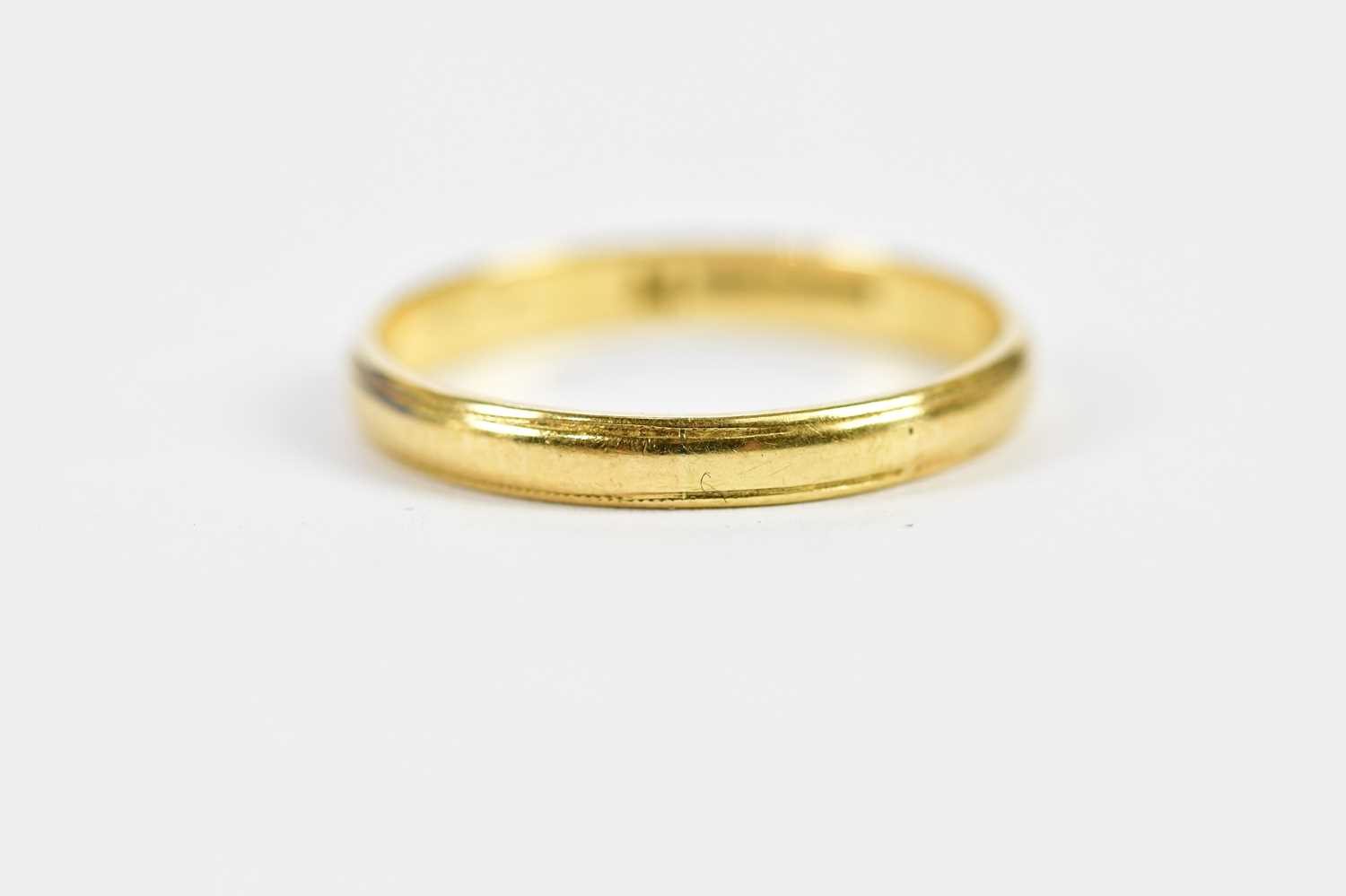 An 18ct yellow gold wedding band, size N 1/2, approx. 2.1g.