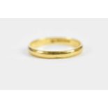 An 18ct yellow gold wedding band, size N 1/2, approx. 2.1g.