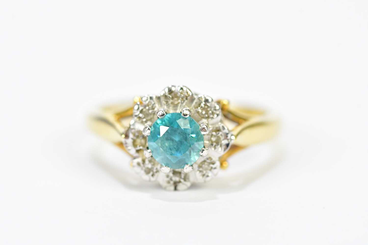 An 18ct yellow gold topaz and diamond floral cluster ring, size K, approx. 4.62g.