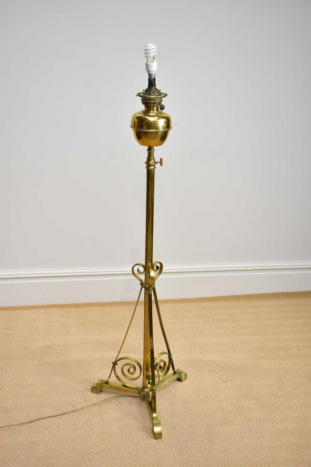 An early 20th century brass telescopic oil lamp, converted, height 140cm.