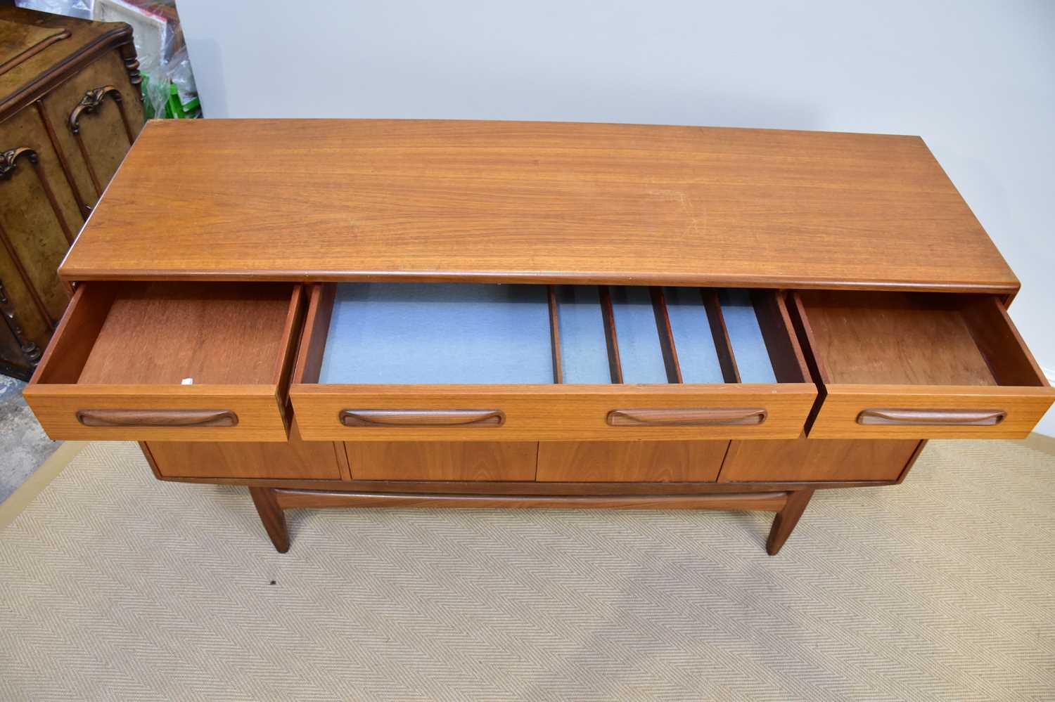 G-PLAN; a 'Fresco' range teak sideboard with three drawers above four panelled cupboard doors, on - Image 2 of 3