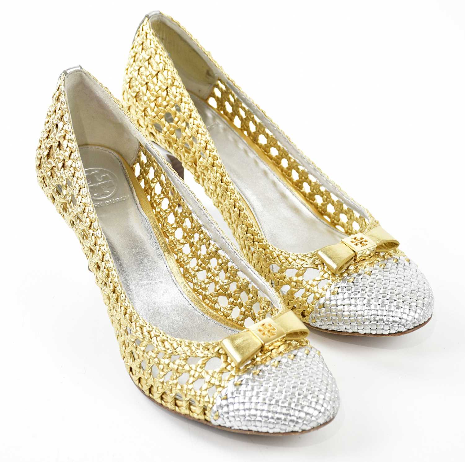 TORY BURCH; a pair of gold and silver metallic Carlyle Madras court shoes with gold tone maker's