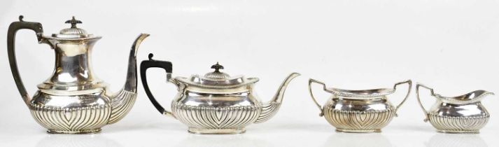 A silver plated four piece tea service with gadrooned decoration to the lower body, with
