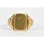 A 9ct yellow gold signet ring with engraved initials to the platform, size T 1/2, approx 4.38g.