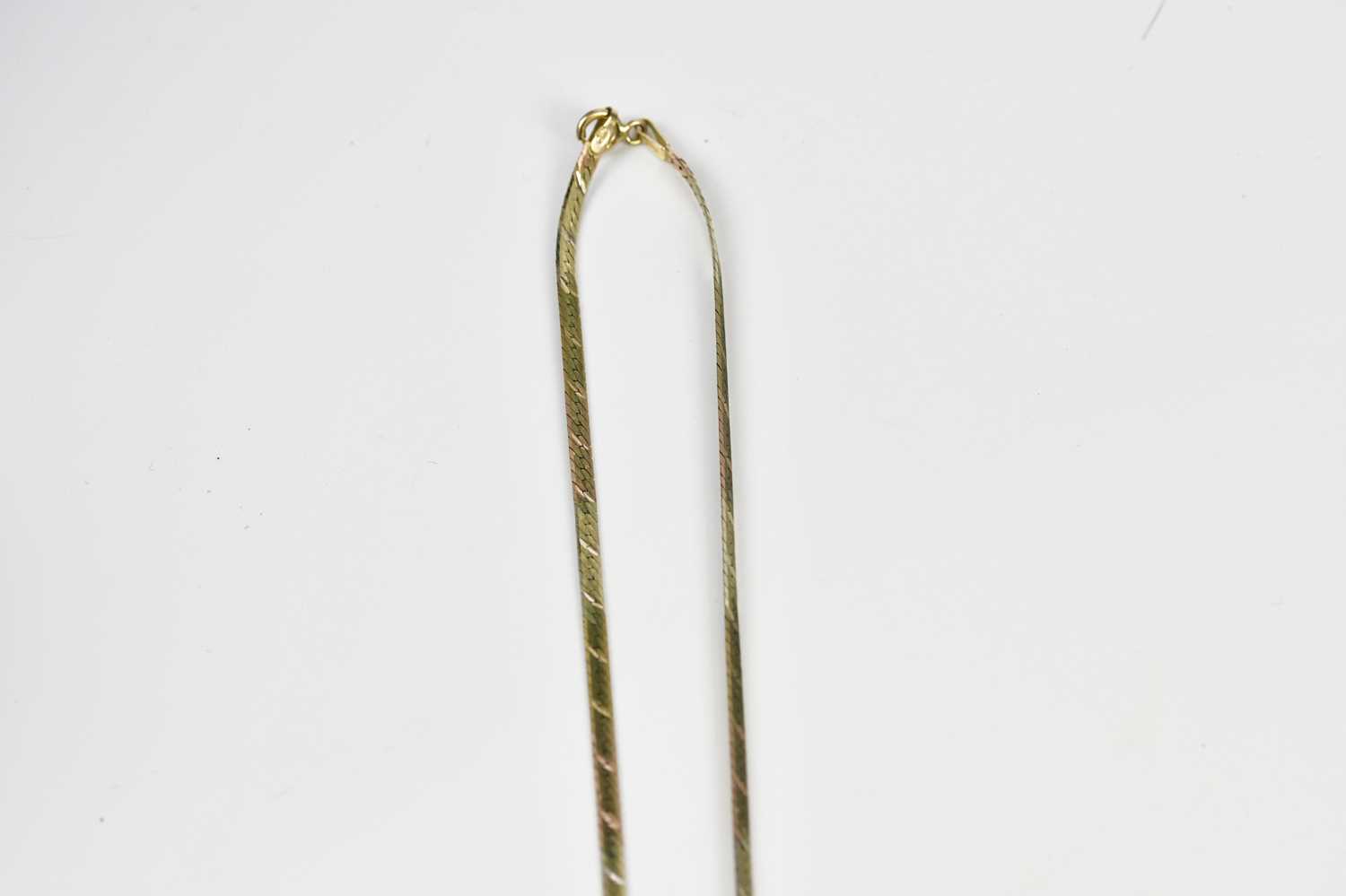 A 9ct three tone gold flat link necklace and matching bracelet, combined approx 6.2g. - Image 2 of 3