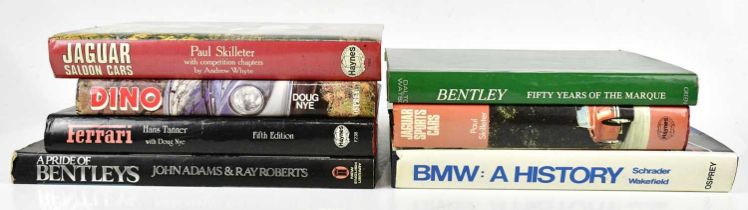 A small collection of automobile related books including 'BMW: A History', 'Jaguar Sports Cars', '