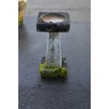 A reconstituted stone bird bath, height 70cm.