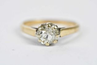 A yellow metal diamond solitaire ring, the claw set stone weighing approx. 0.90cts, size O,