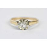 A yellow metal diamond solitaire ring, the claw set stone weighing approx. 0.90cts, size O,