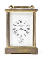 CHARLES FRODSHAM, LONDON; a reproduction brass cased carriage clock, the enamel dial set with