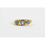 An 18ct yellow gold sapphire and diamond dress ring, size I 1/2, approx. 3.1g.