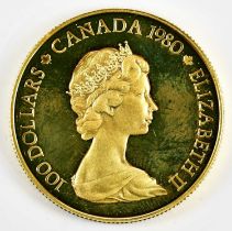 An Elizabeth II Canadian 1980 one hundred dollar eskimo gold coin, approx 17.3g, boxed with