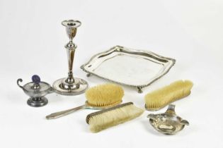 A hallmarked silver mounted dressing table brush, marks worn, with a wine taster / ash tray, a