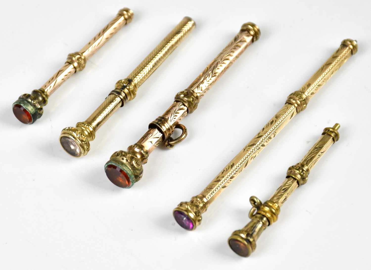 Five Victorian yellow metal propelling pencils, including an example with engine turned - Image 2 of 2