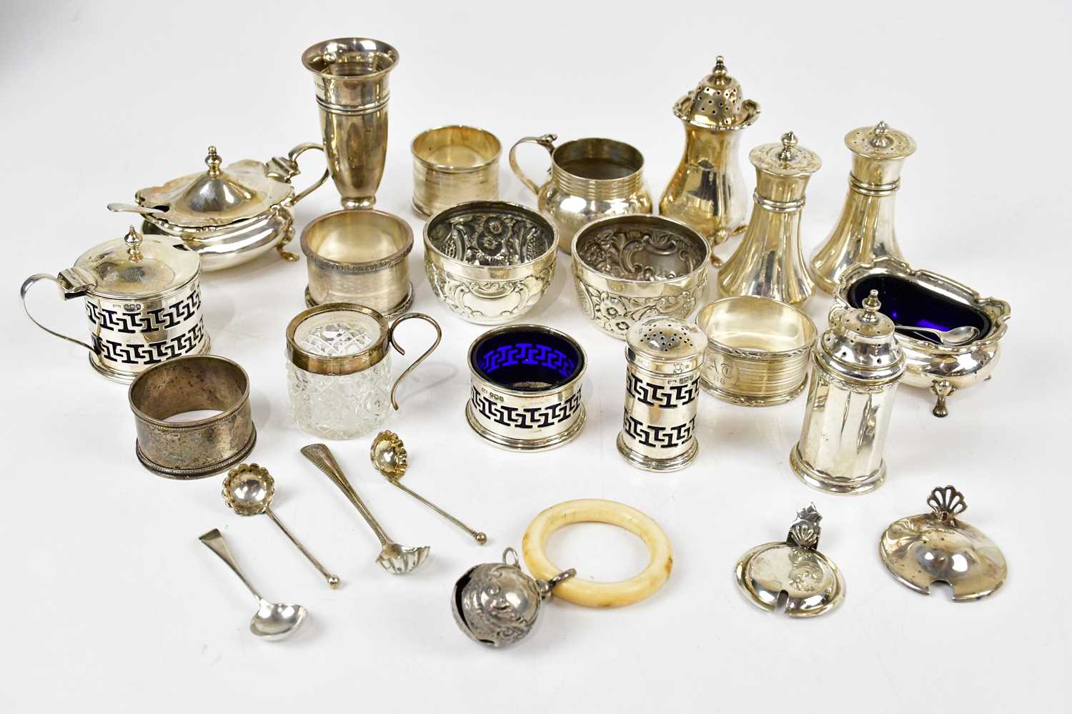 STOKES & IRELAND; a pair of Victorian hallmarked silver open salts with gadrooned decoration,