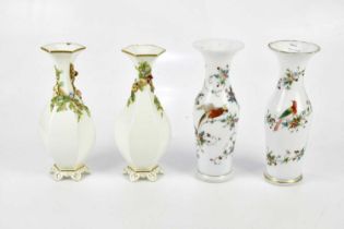 A pair of Victorian painted milk glass vases decorated with exotic birds, height 25.5cm, and a