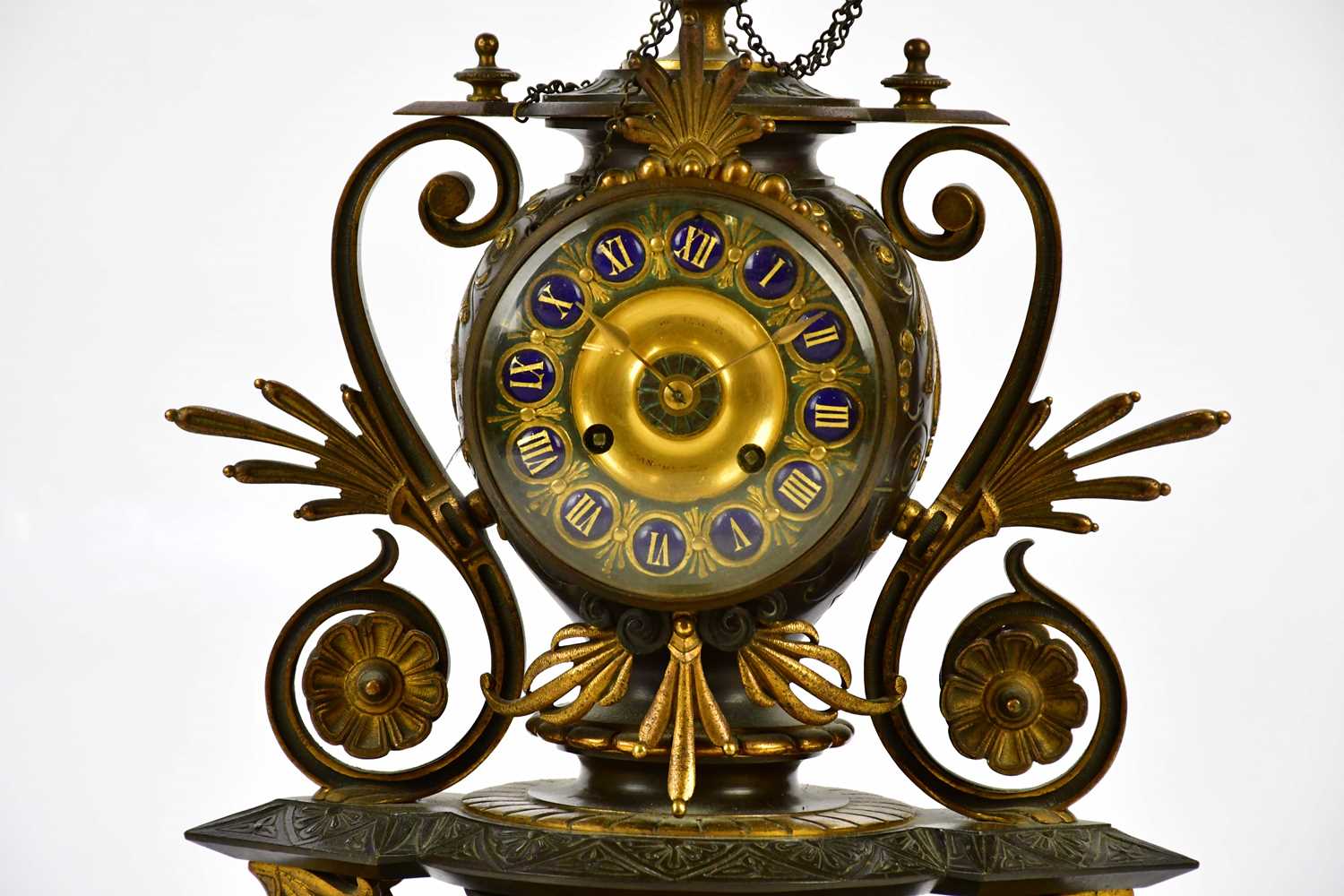 An aesthetic movement French bronze and gilt metal mantel clock with circular finial above the - Image 2 of 10