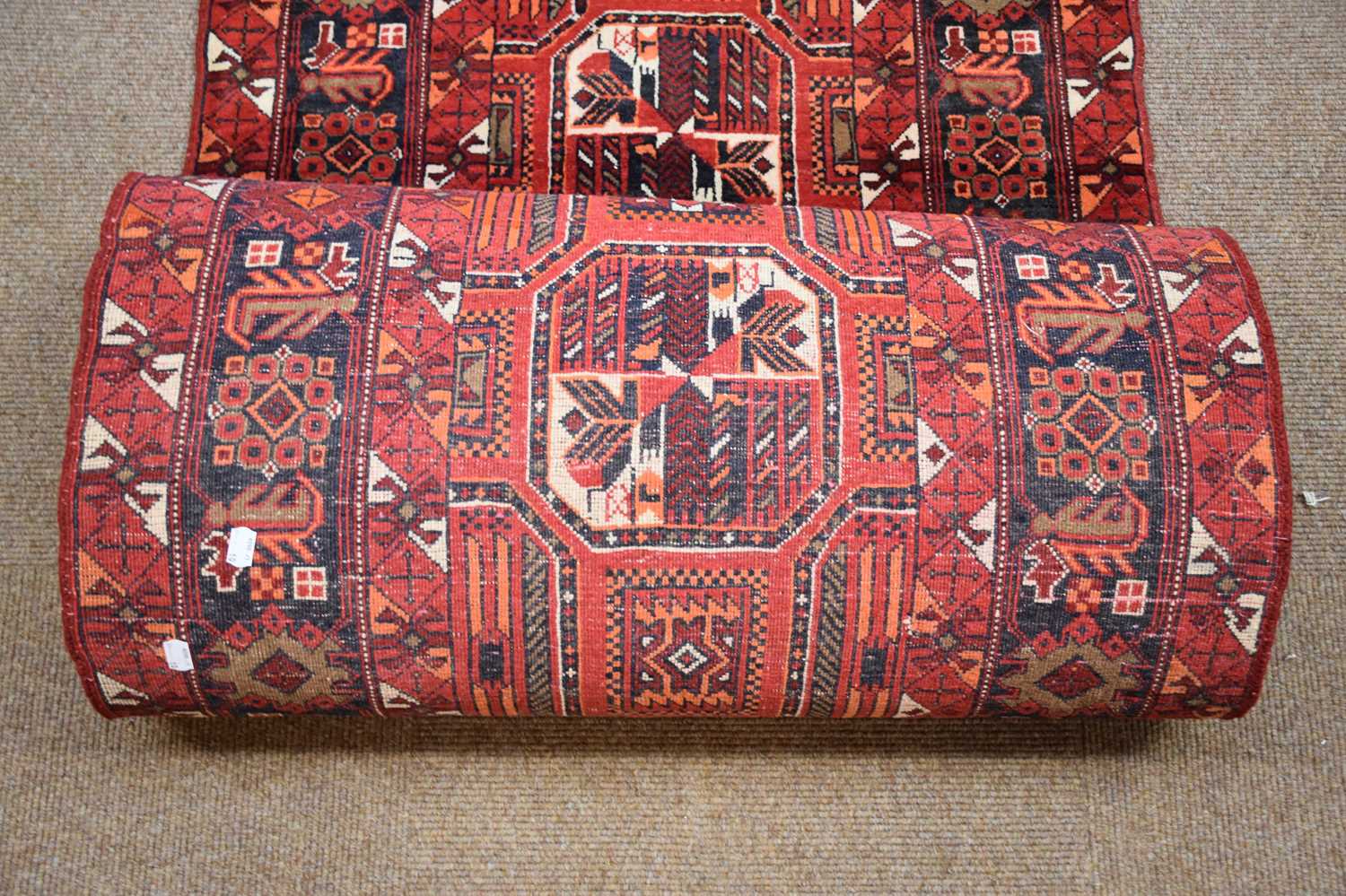 A Caucasian hand woven wool runner, worked with geometric detailing against a red ground, 355 x - Image 2 of 3