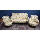 A Victorian three piece lounge suite, comprising two seater settee and two elbow chairs, each