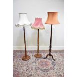 Three 20th century standard lamps, including a barley twist example, height of largest 147cm (3)