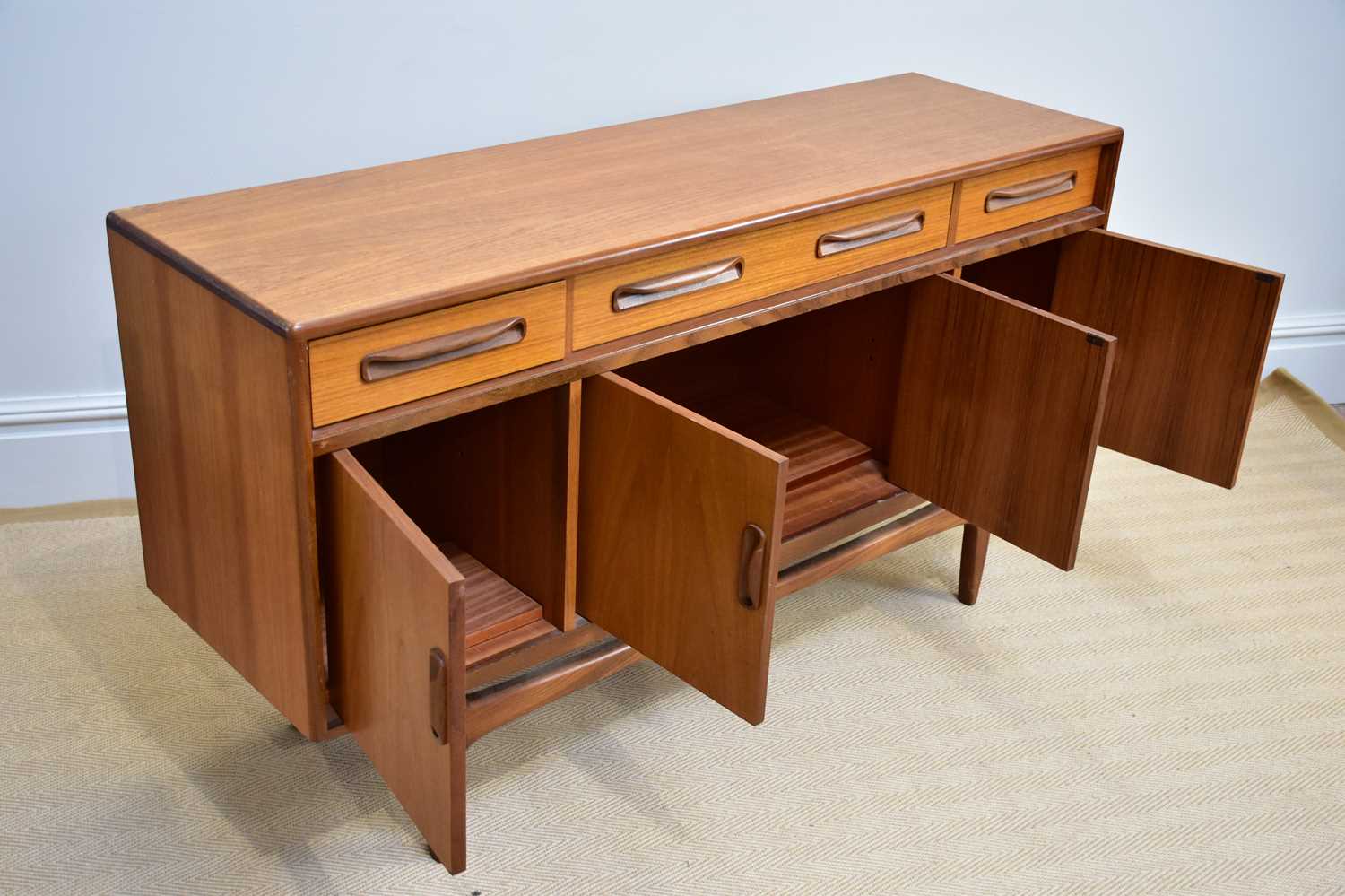 G-PLAN; a 'Fresco' range teak sideboard with three drawers above four panelled cupboard doors, on - Image 3 of 3