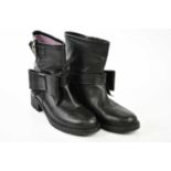 RED VALENTINO; a pair of black leather short ankle boots with buckle and bow detail, block heels and