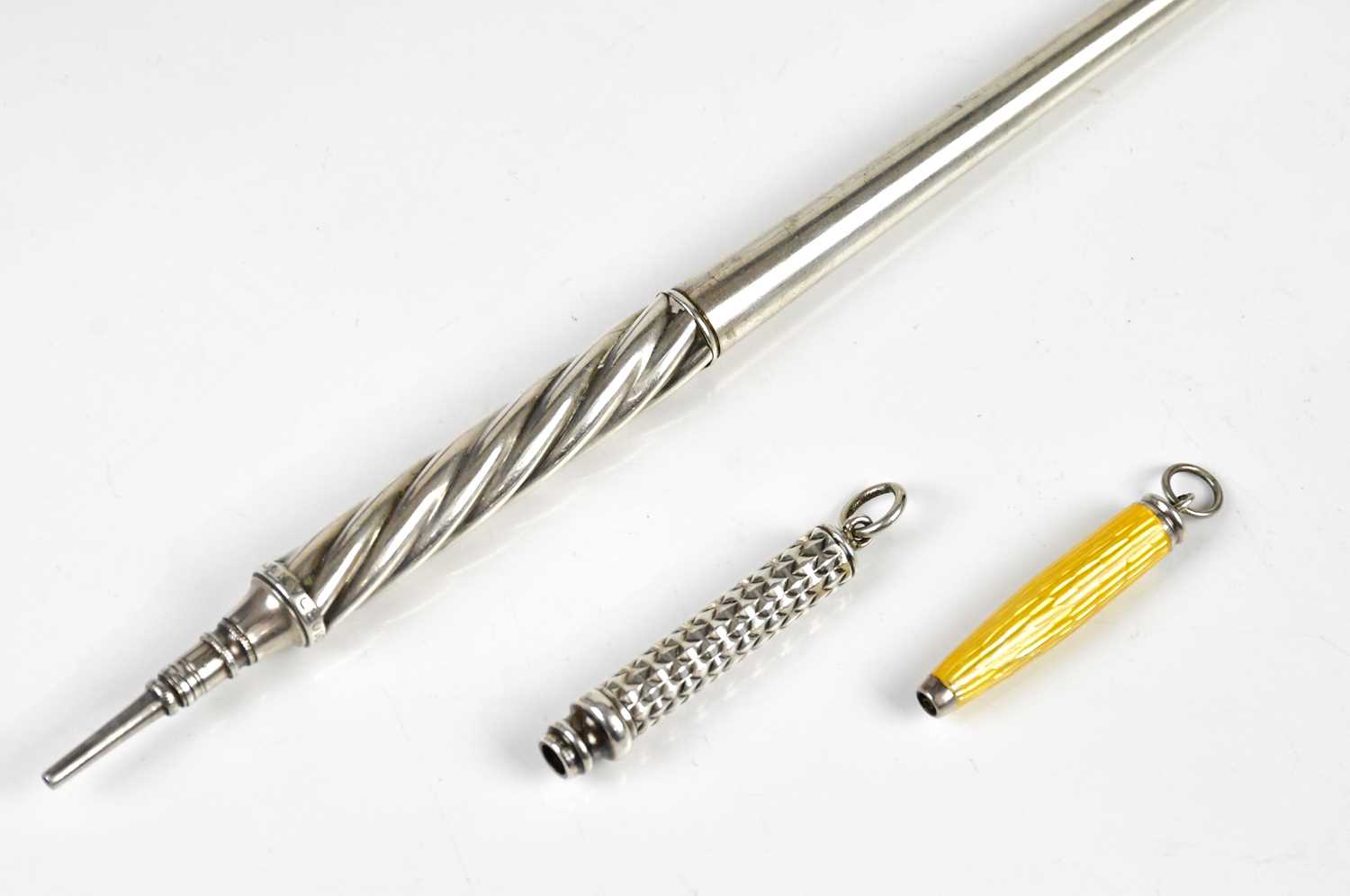 SAMPSON MORDAN; a white metal pencil of tapering form with wrythen grip, length 19cm, a miniature - Image 2 of 2