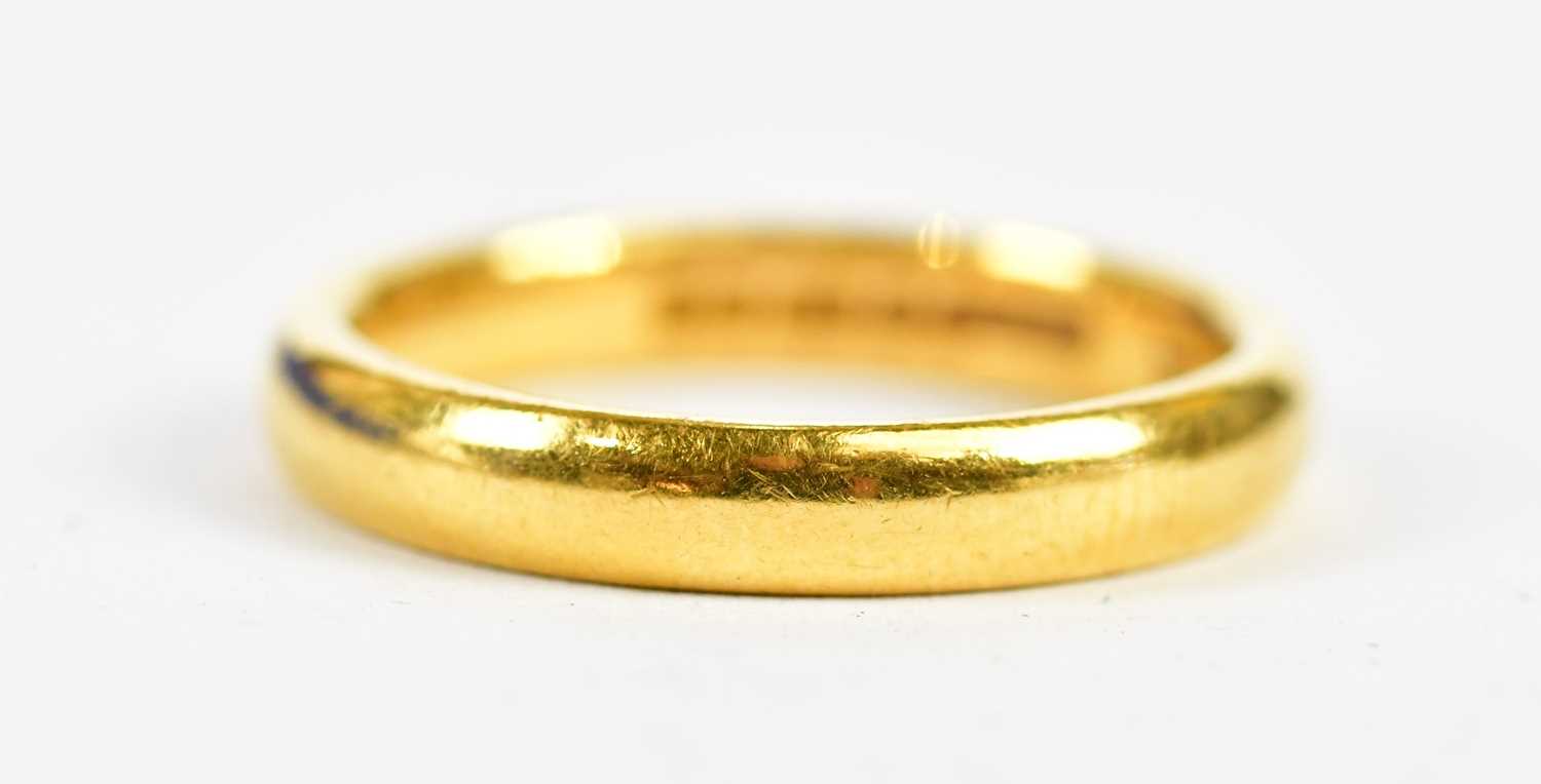 A 22ct yellow gold wedding band, size N, approx 5.68g.