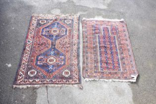 A Caucasian handwoven wool rug, decorated with a geometric pattern against a blue ground, 160 x