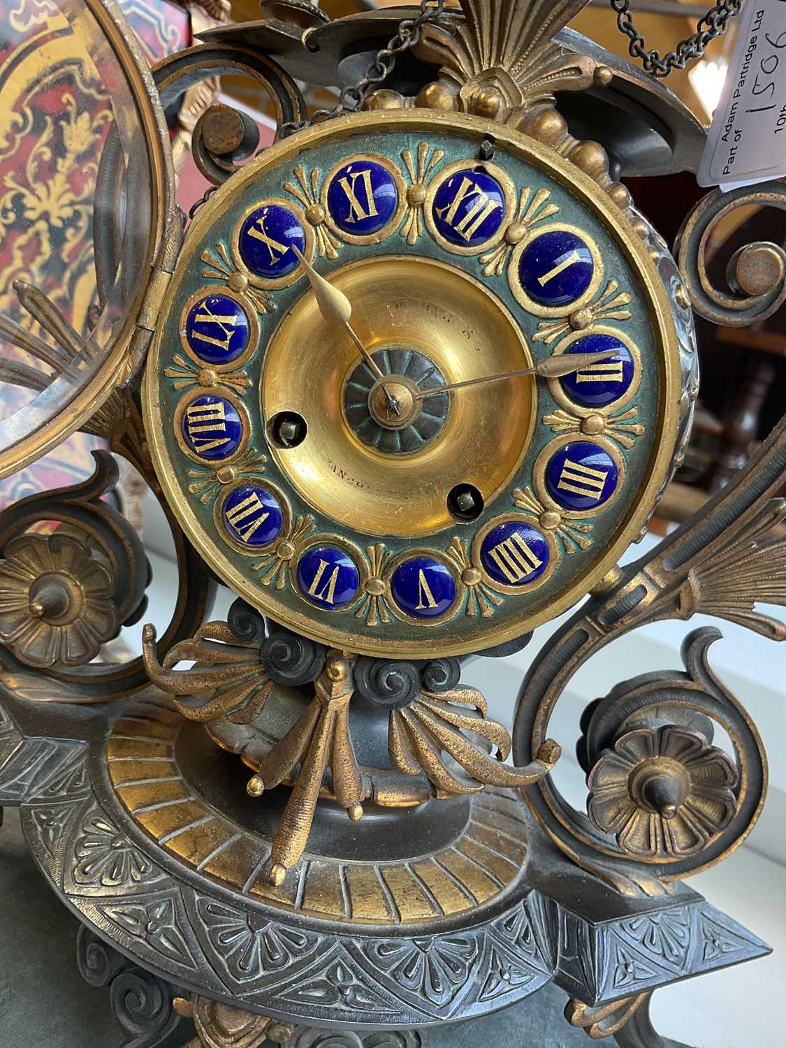 An aesthetic movement French bronze and gilt metal mantel clock with circular finial above the - Image 8 of 10